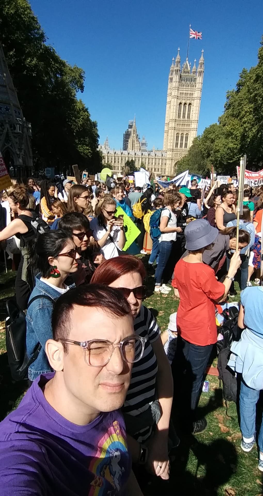 Ean and Victoria standing amongst thousands of climate change protesters