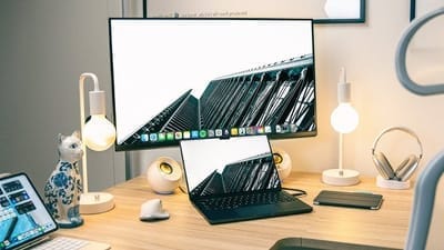 An M4 Mac Book Pro on a desk with other common items